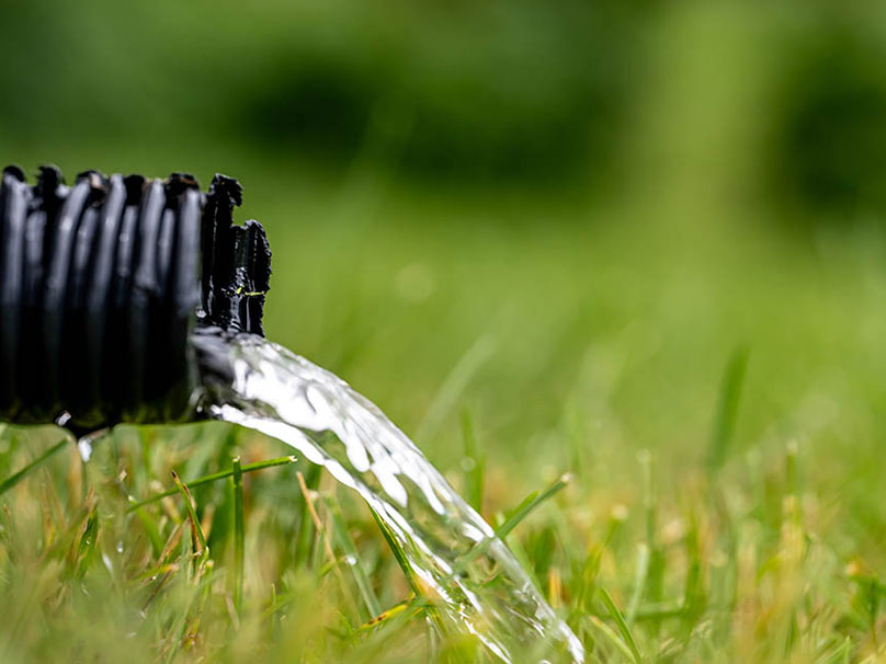 Sump pump draining in to a yard