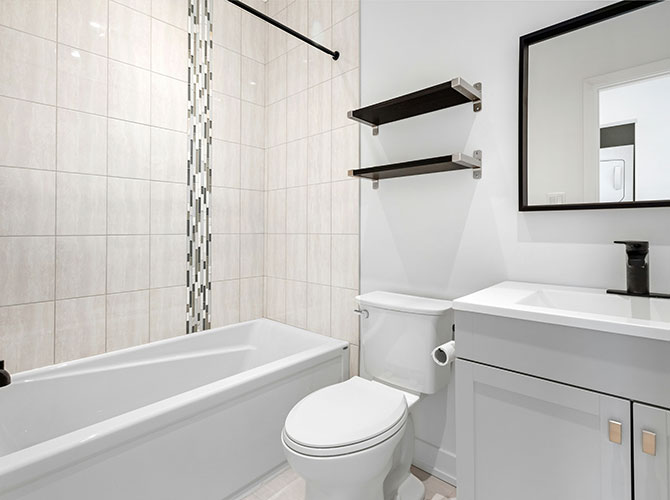 Clean white bathroom with black accents